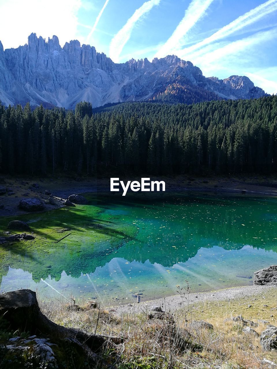 SCENIC VIEW OF LANDSCAPE WITH MOUNTAINS IN BACKGROUND