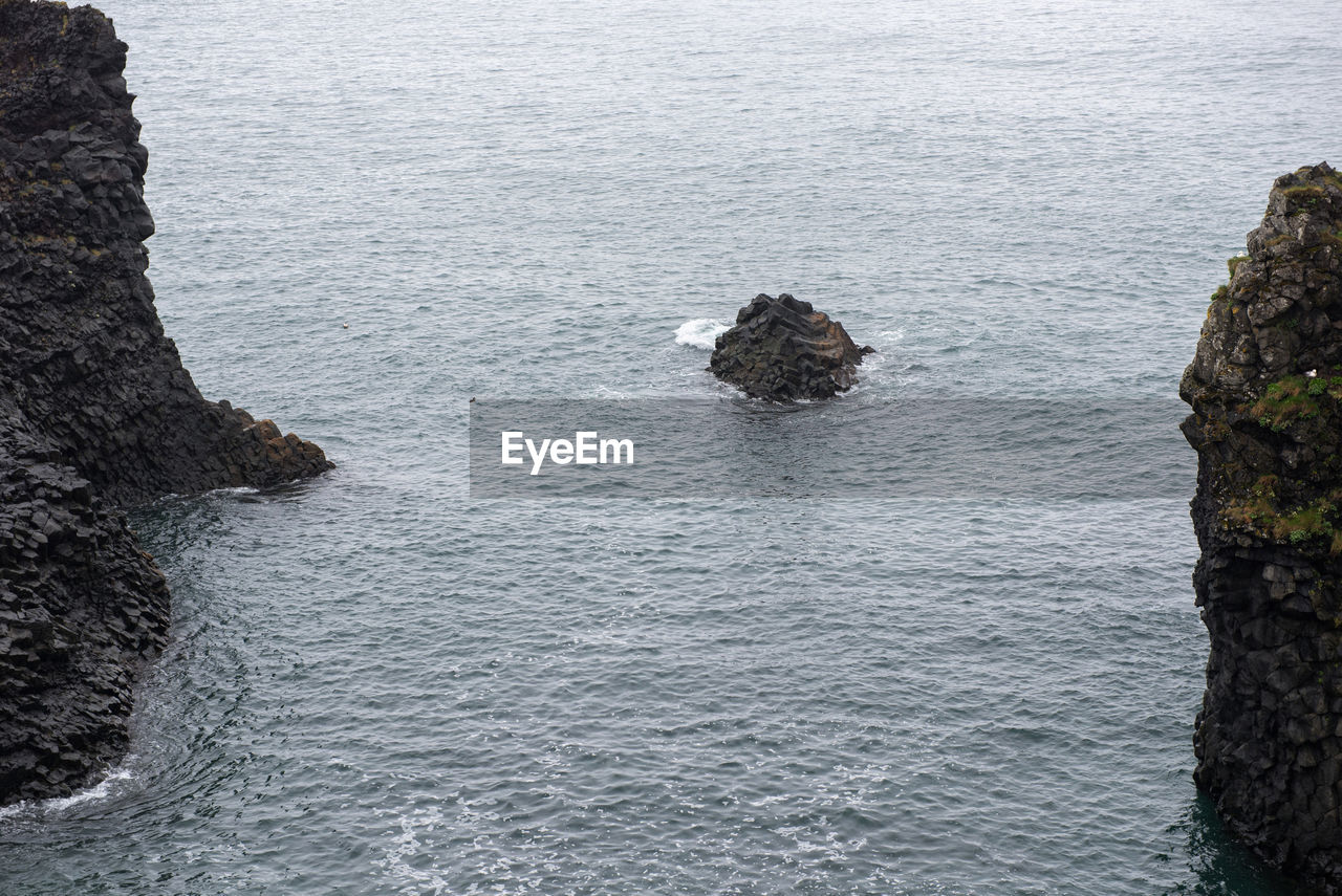 High angle view of rocks in sea