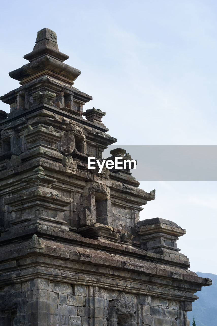 Top spire detail of candi arjuna, historical hindu temple, dieng plateau, central java, indonesia