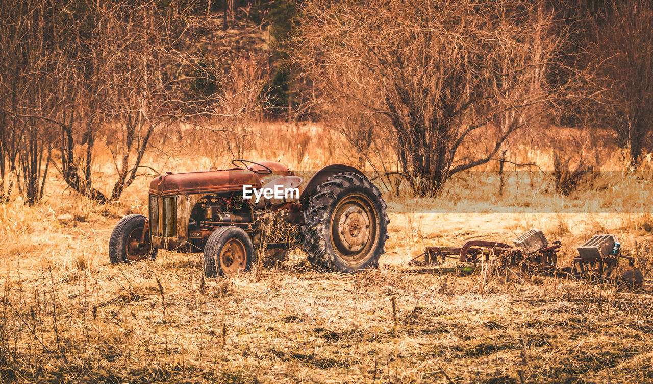 Abandoned tractor on field