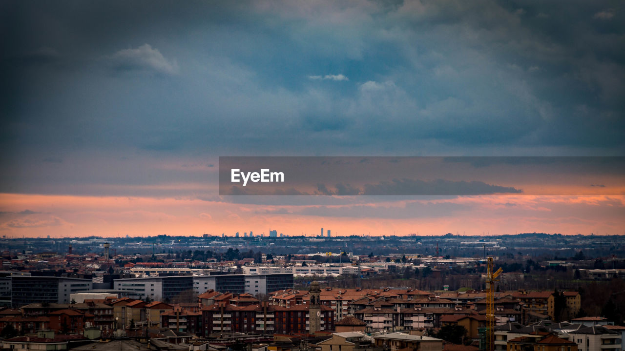 Cityscape against sky during sunset