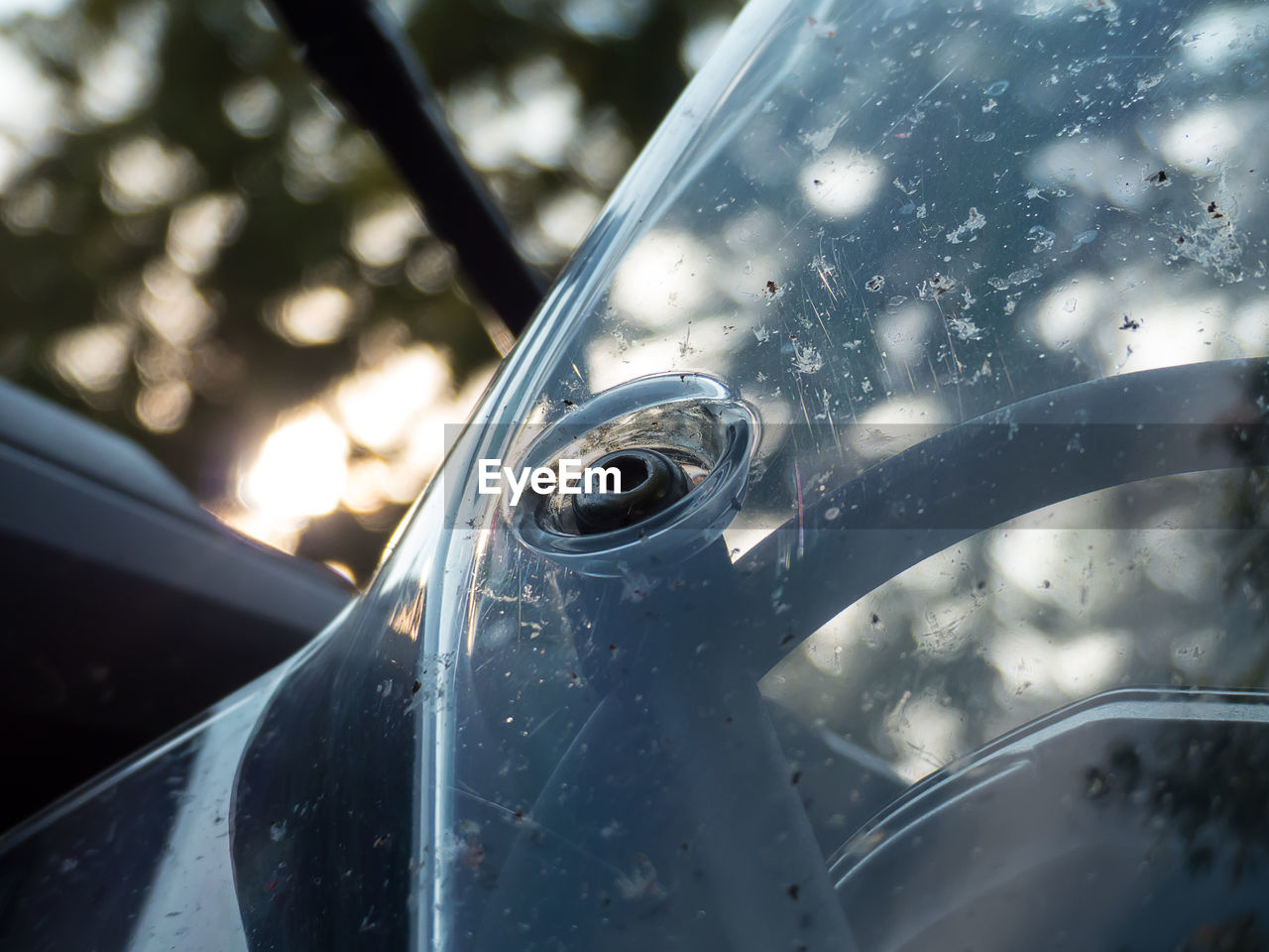 Close-up of dirty motorcycle windshield