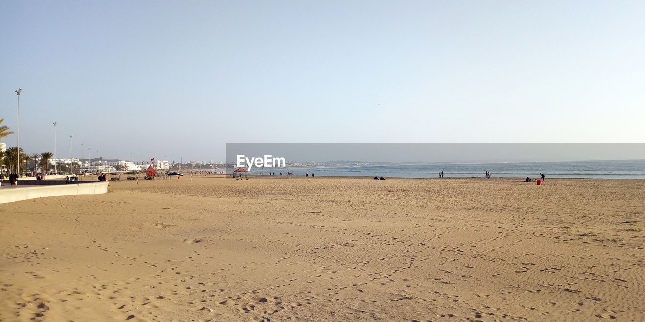 Scenic view of beach against clear sky