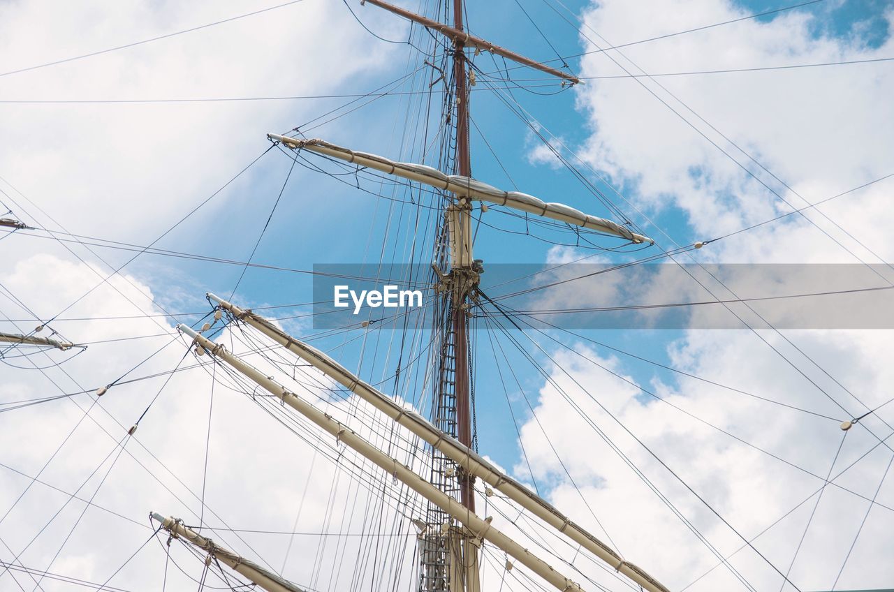 Low angle view of mast against sky