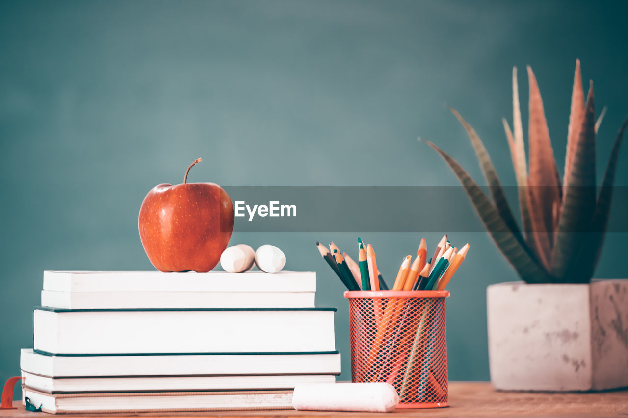 STACK OF APPLE ON SHELF