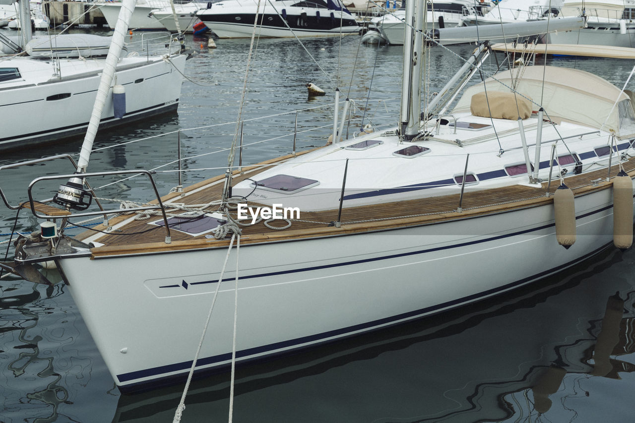 Yacht moored in water at harbor