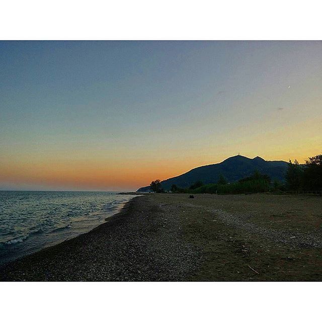 VIEW OF SEA AT SUNSET