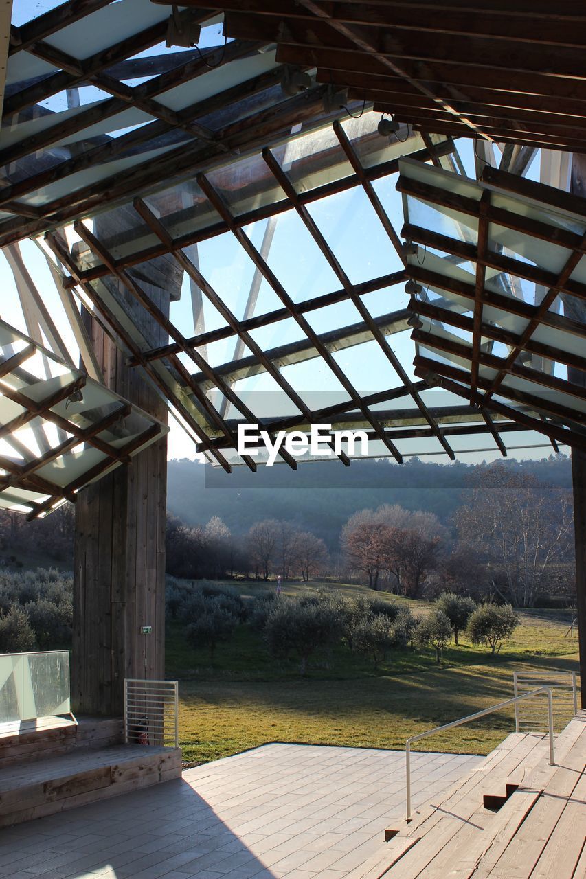 TILT IMAGE OF ROOF SEEN THROUGH GLASS