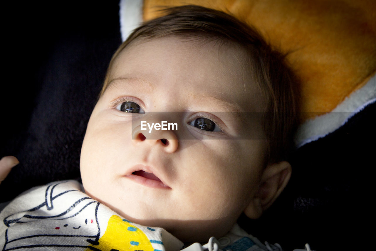 child, childhood, baby, portrait, person, one person, cute, innocence, skin, indoors, headshot, human face, looking at camera, emotion, babyhood, human eye, toddler, lying down, close-up, portrait photography, facial expression, baby clothing, beginnings, nose, sadness, front view, eye, human head, looking, clothing, lifestyles