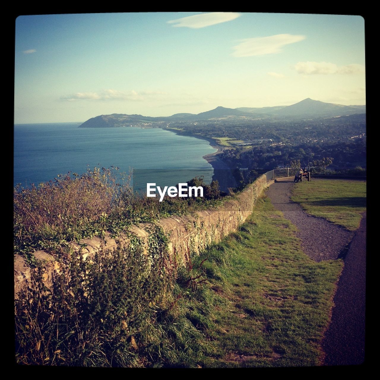 High angle view of calm blue sea along landscape