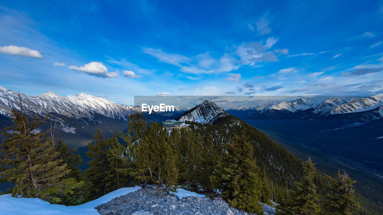  the evening sunlight fades toward twilight on top of sulfer mountain in banff, alberta, canada.