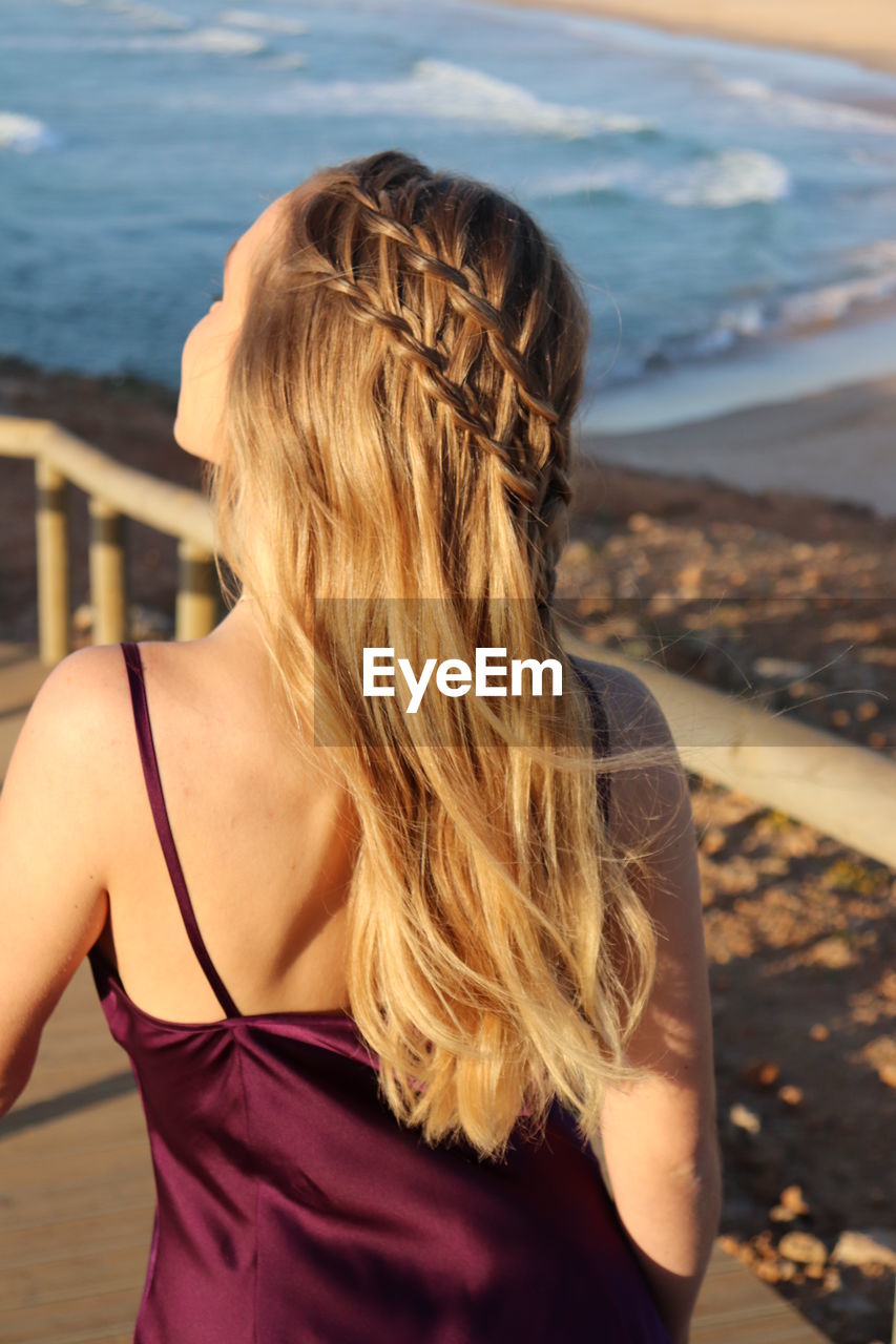 Rear view of woman looking at sea