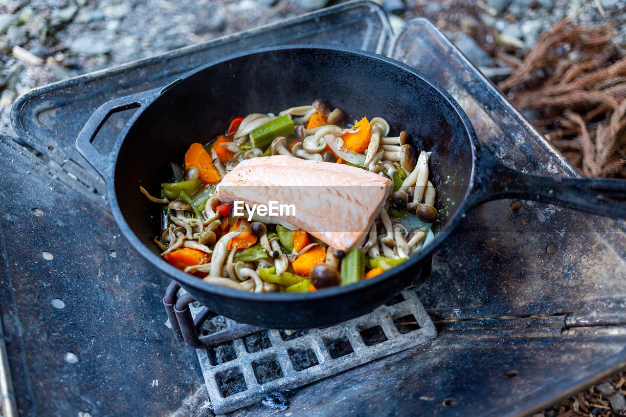 Close-up of food in cooking pan on barbecue grill