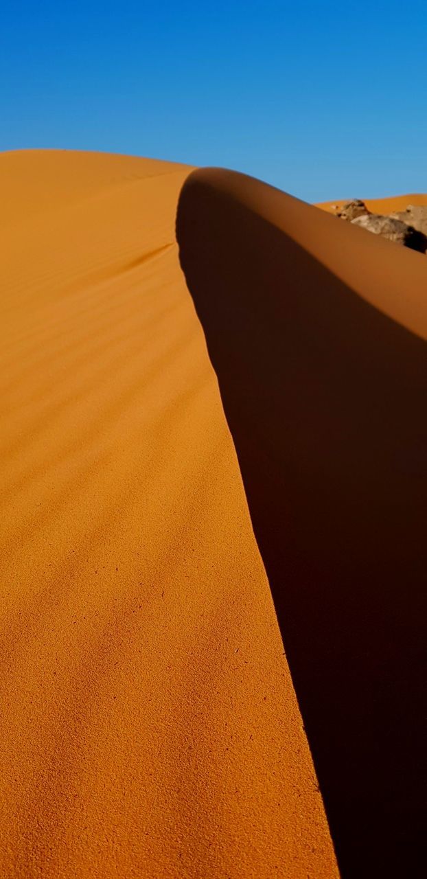 Scenic view of desert against clear sky