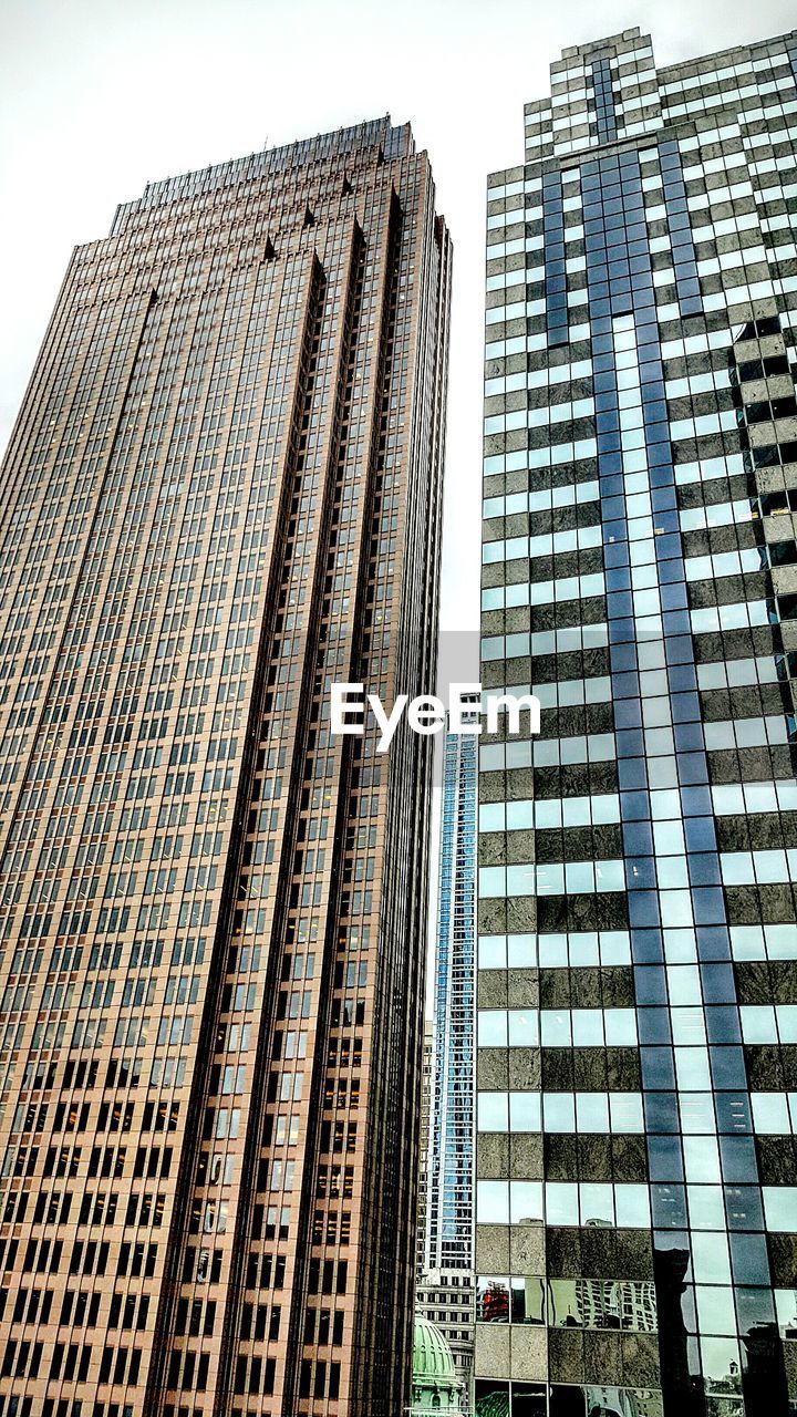 Low angle view of modern buildings against sky