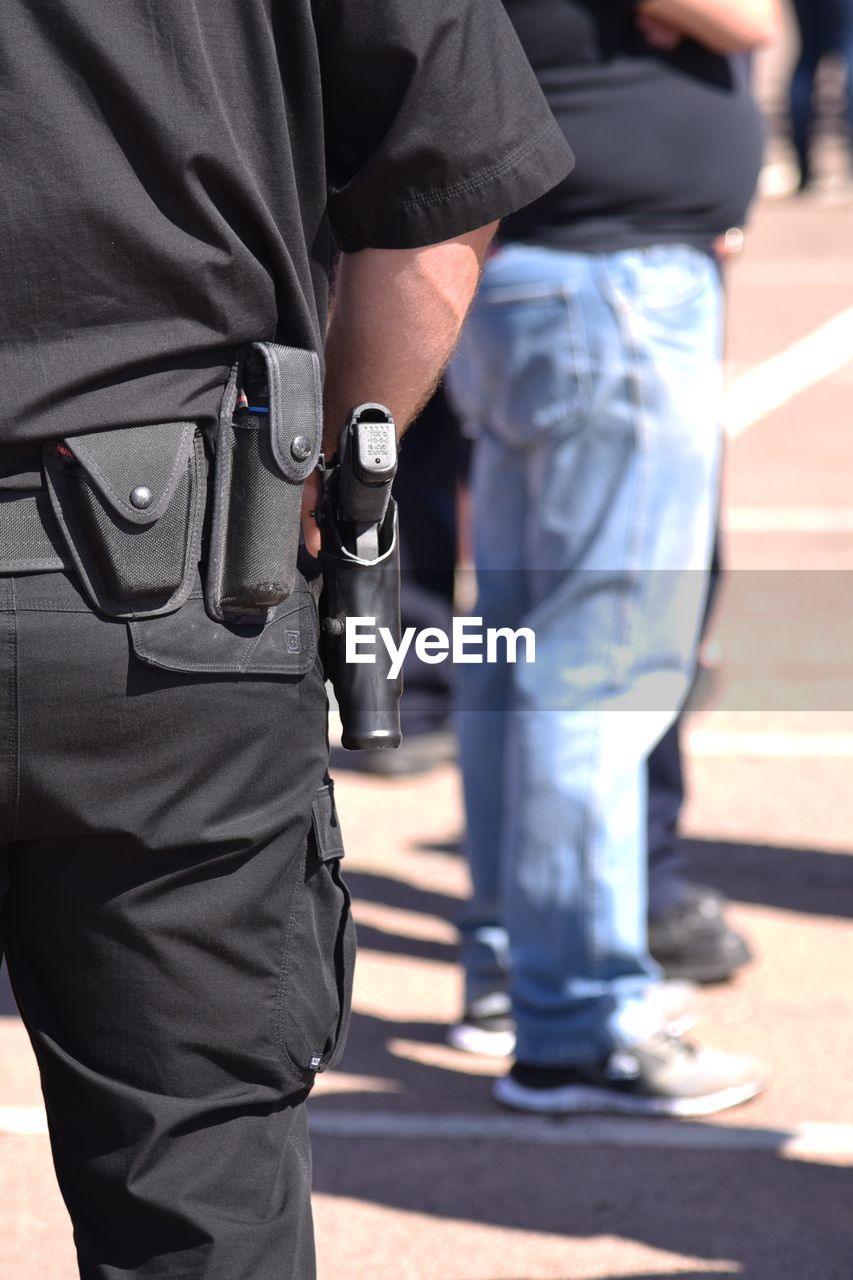 View of policeman's gun in holster