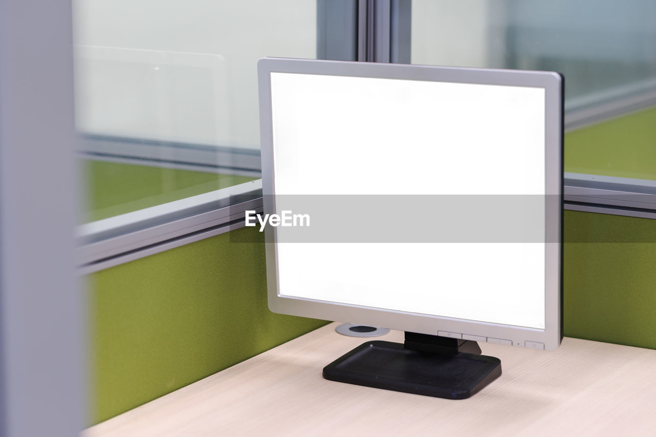 Close-up of blank computer monitor on desk at office