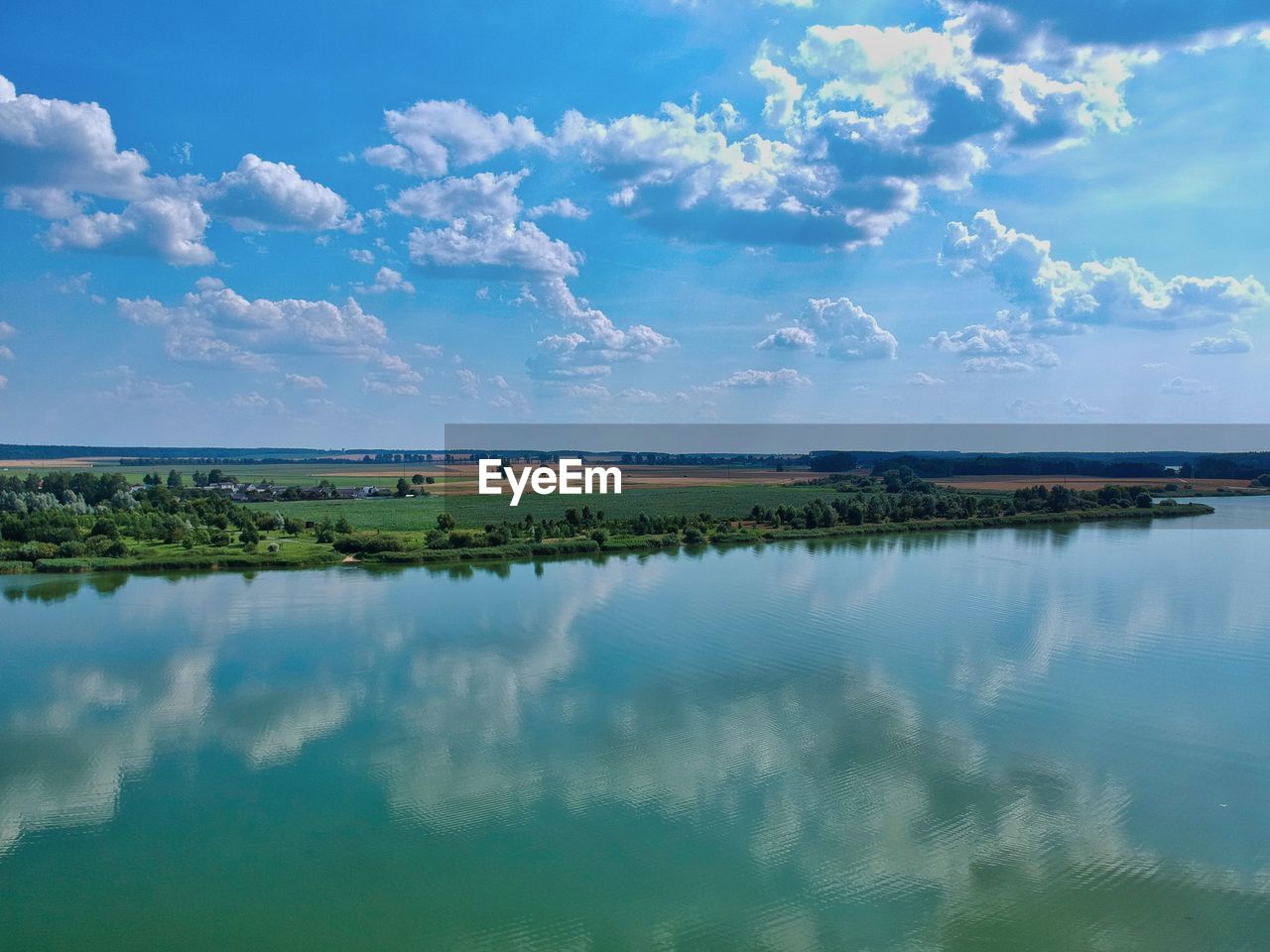 IDYLLIC SHOT OF LAKE AGAINST SKY