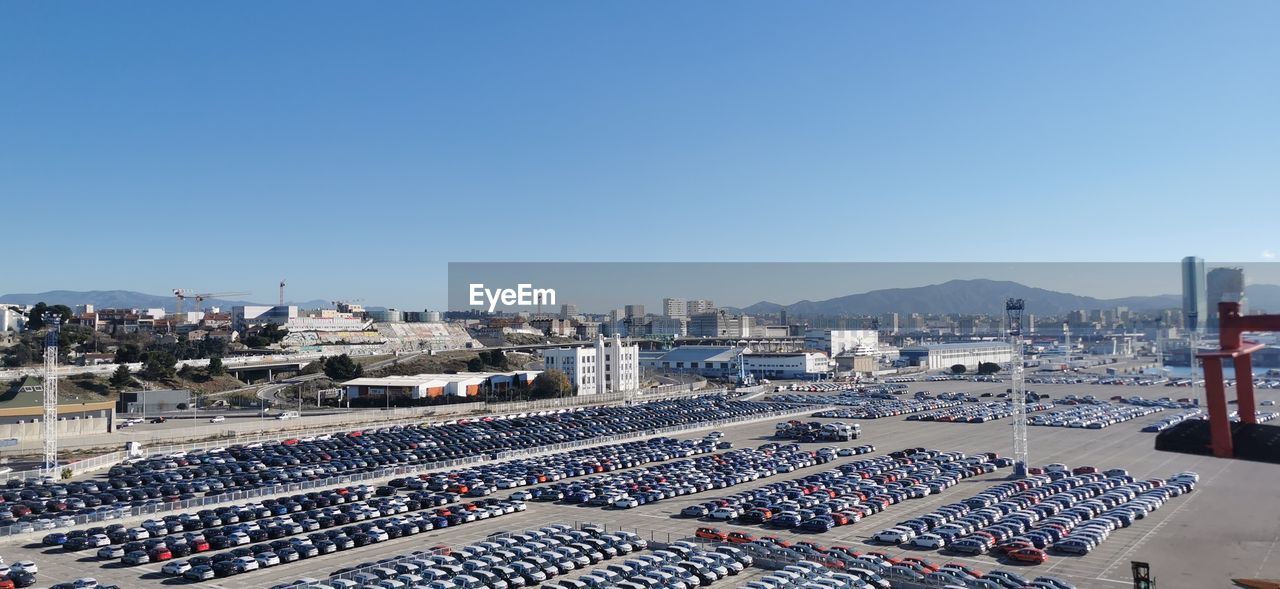 High angle view of cityscape against clear blue sky