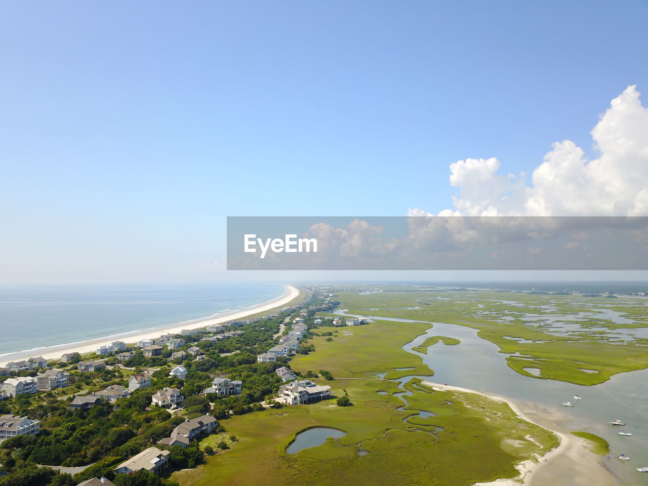 View of beach against blue sky