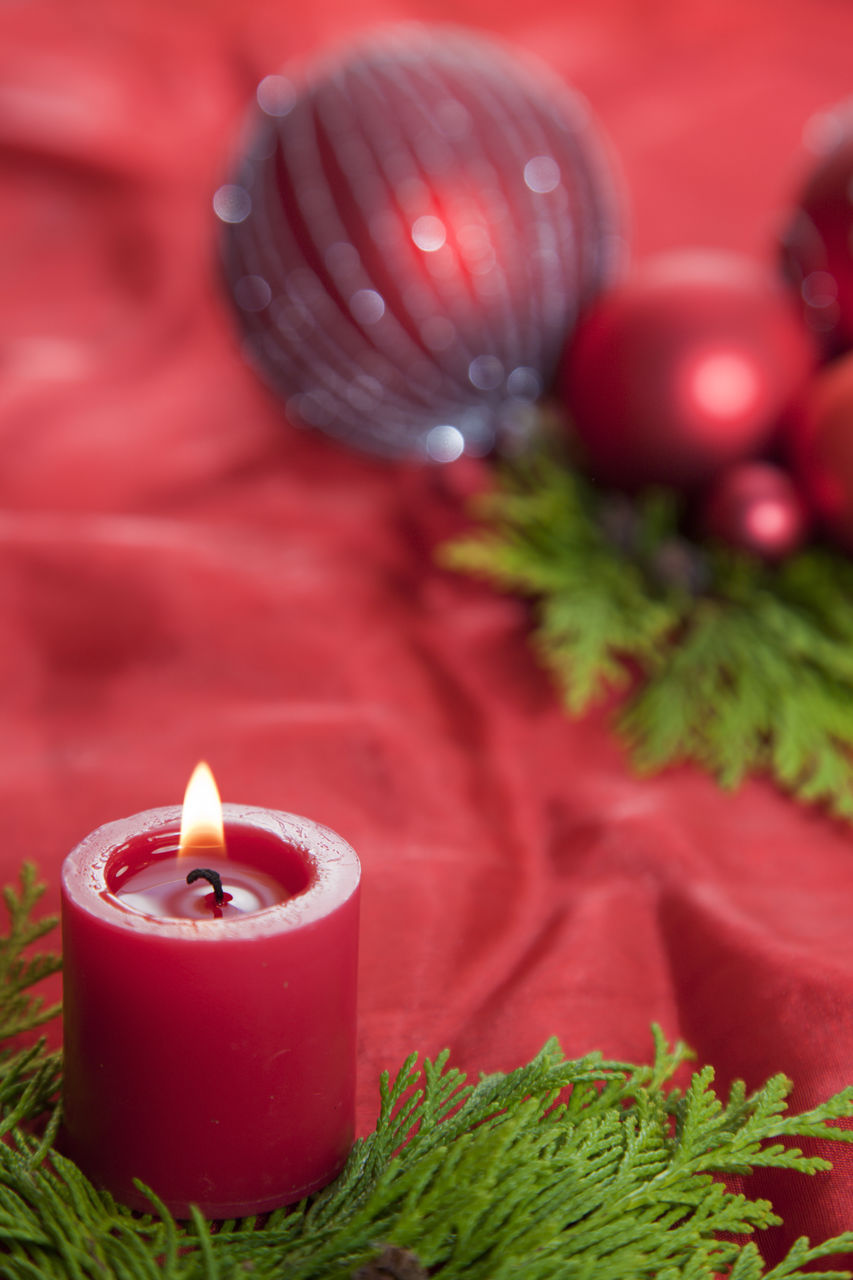 Close-up of tea light candle on table