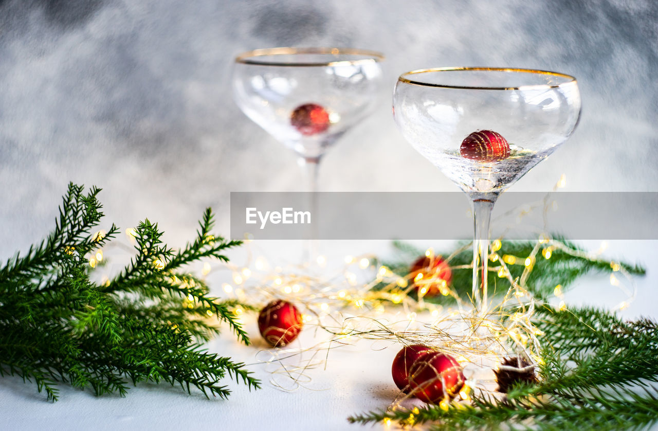 Christmas and new year eve party celebration with champagne glasses and lights