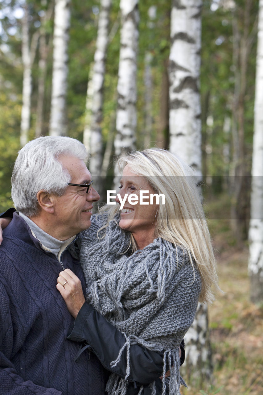 Senior couple hug in forest, delsjon, gothenburg, sweden