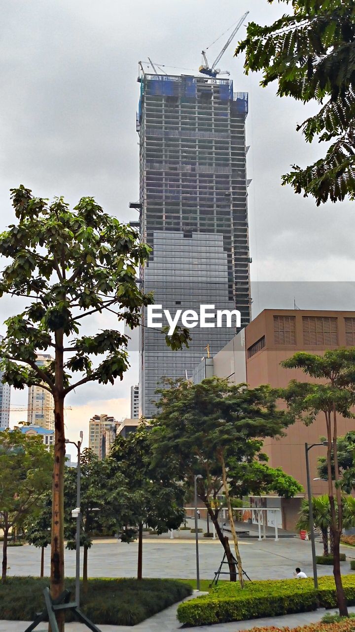 Low angle view of under construction building in city