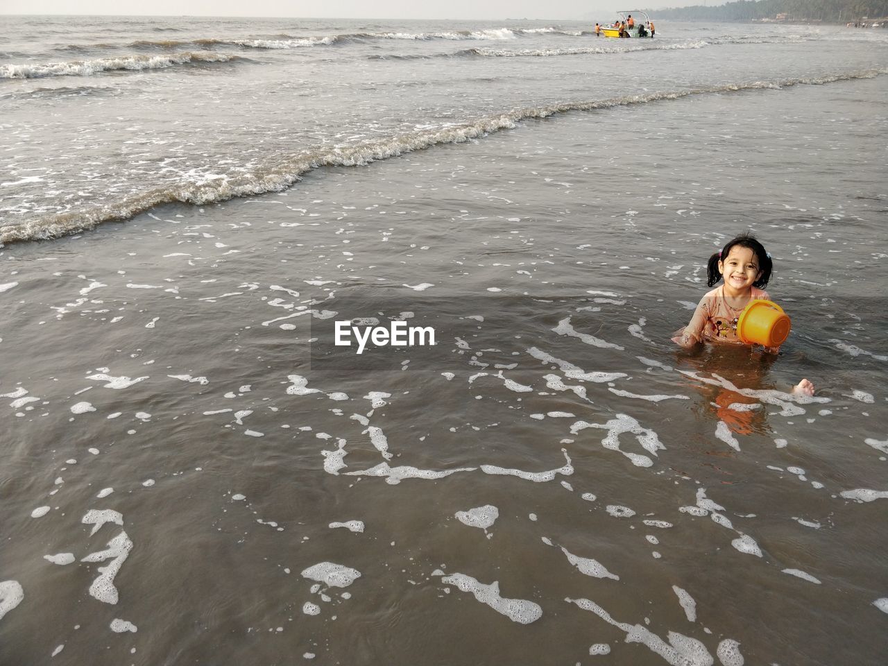 HIGH ANGLE VIEW OF WOMAN ON BEACH