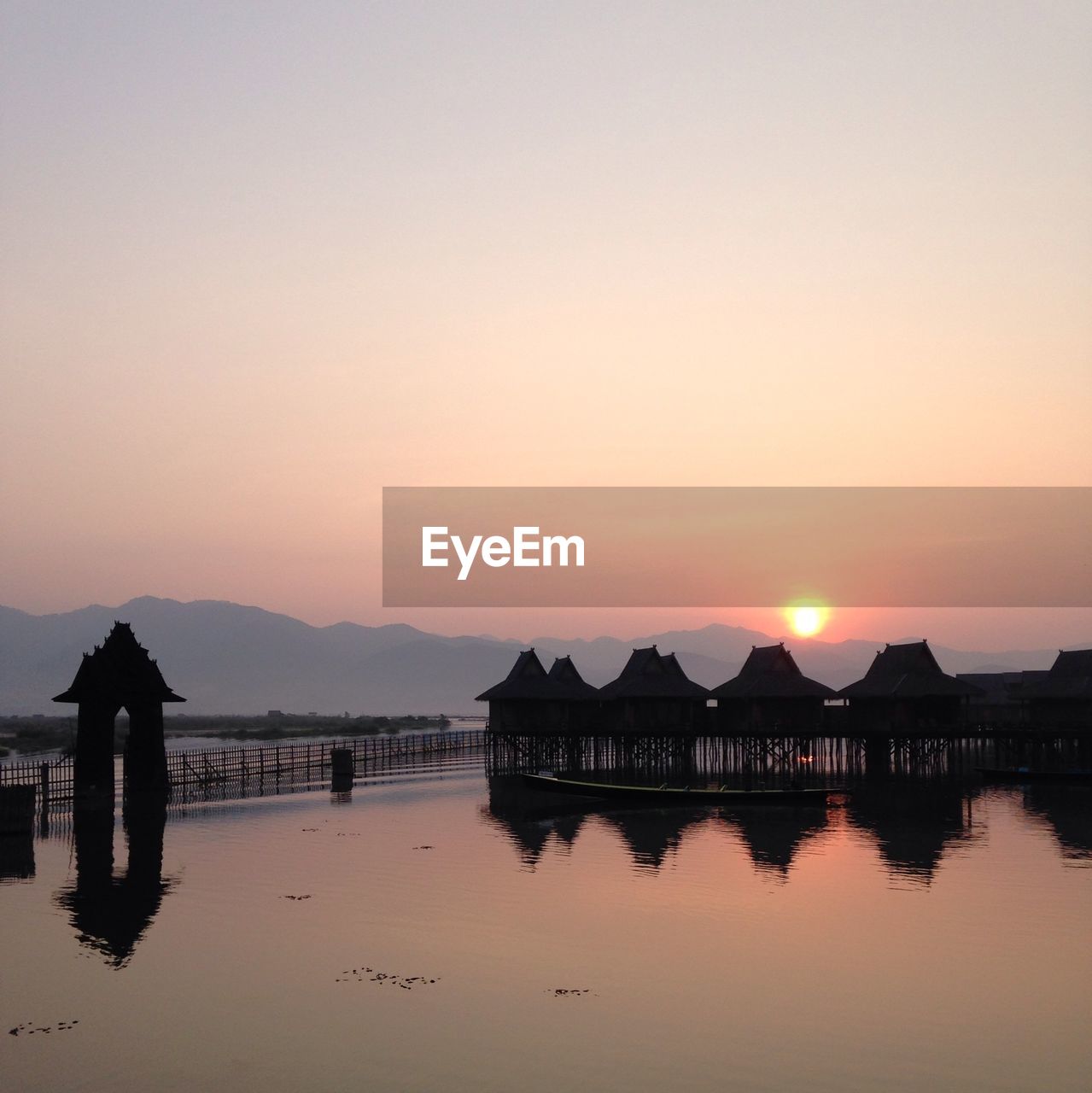 Stilt huts at sunset