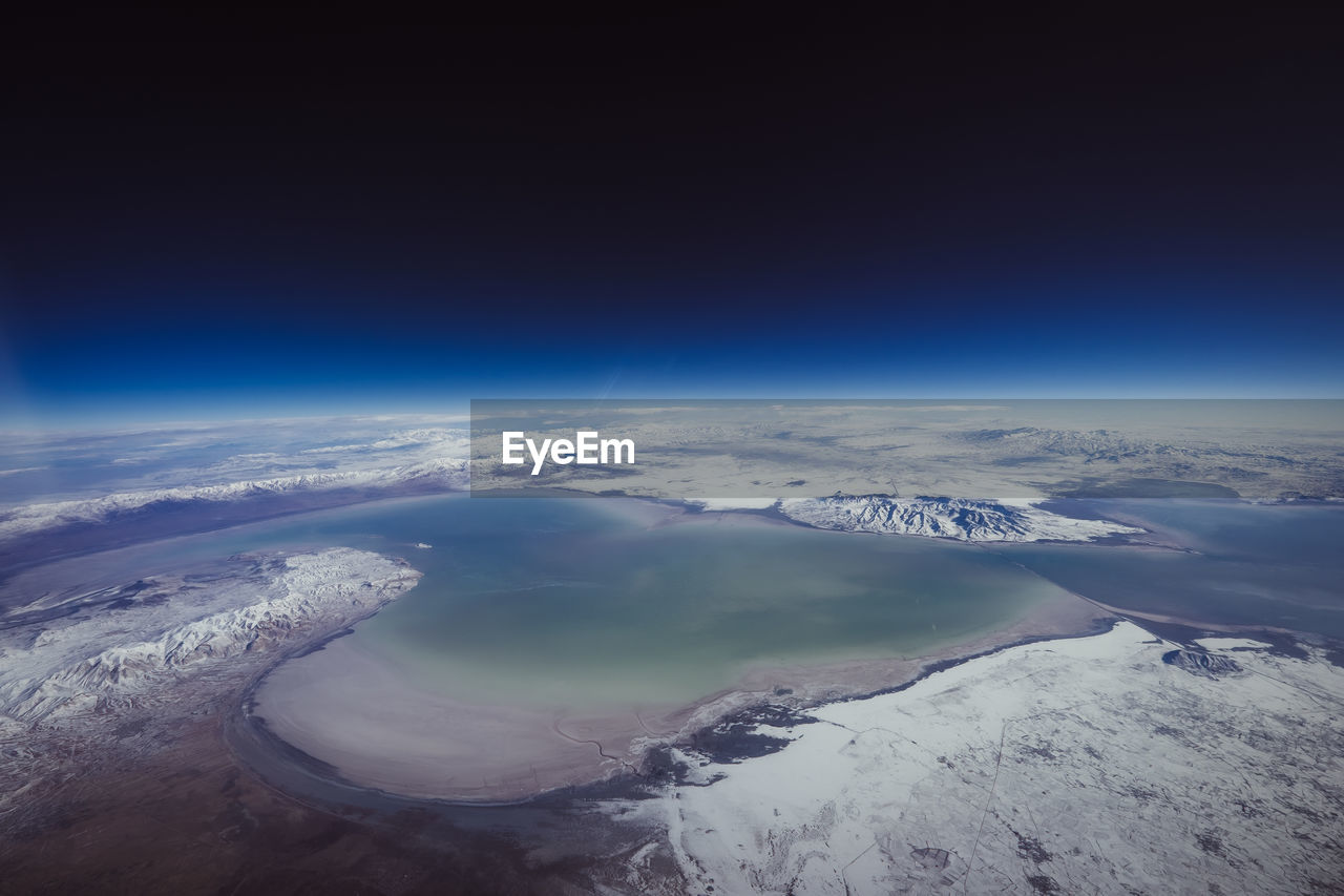 aerial view of sea against blue sky