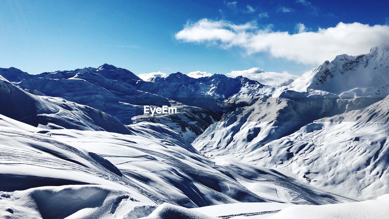 Scenic view of snowcapped mountains against sky