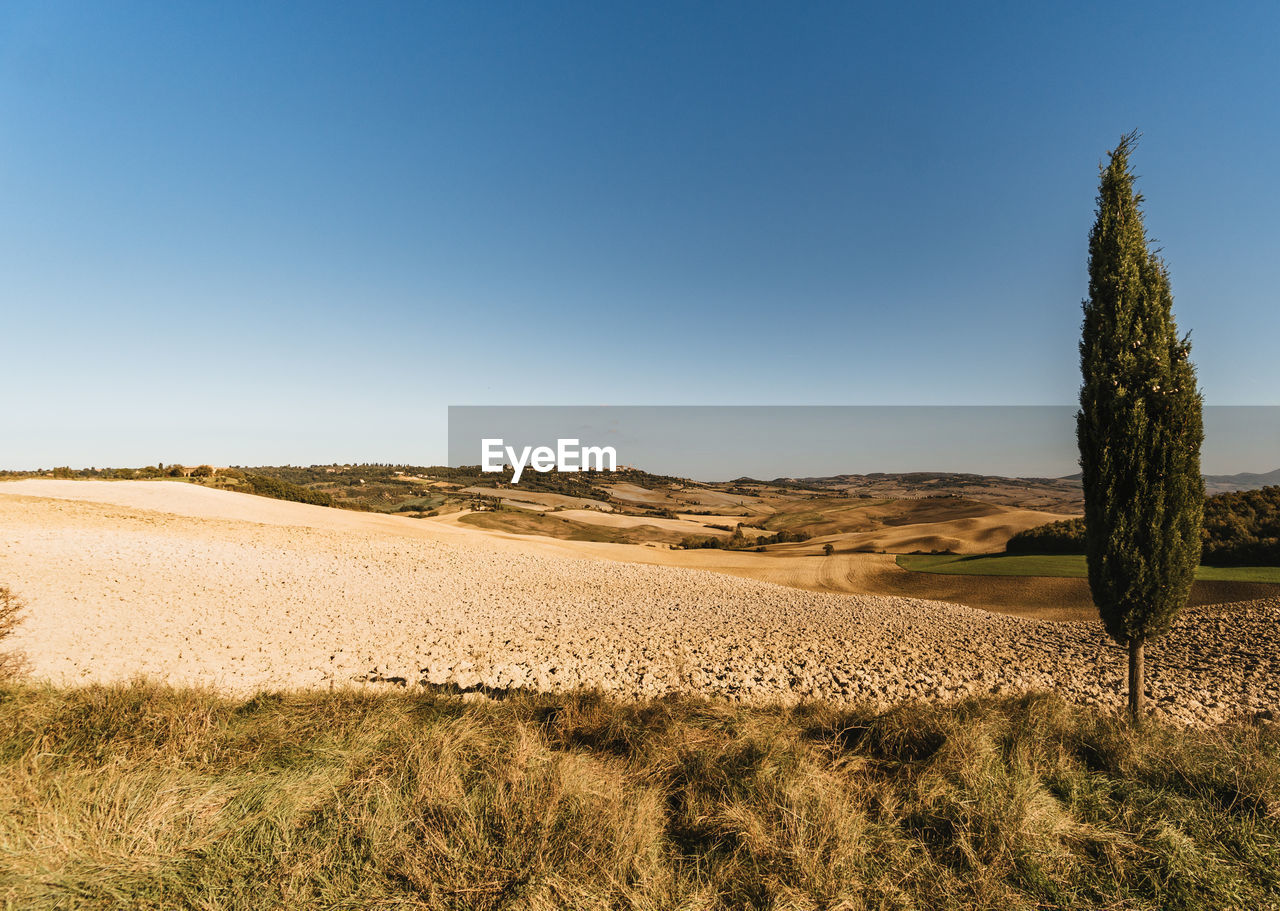 Scenic view of land against clear sky