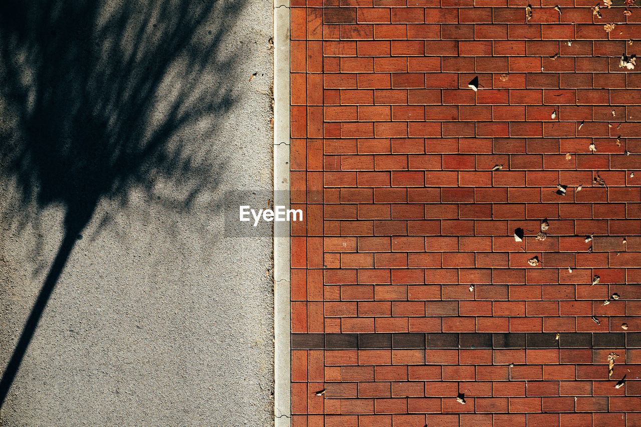 brick, brick wall, wall, architecture, built structure, wall - building feature, red, brickwork, shadow, building exterior, sunlight, day, no people, wood, textured, road surface, full frame, pattern, city, outdoors, brown, backgrounds, nature