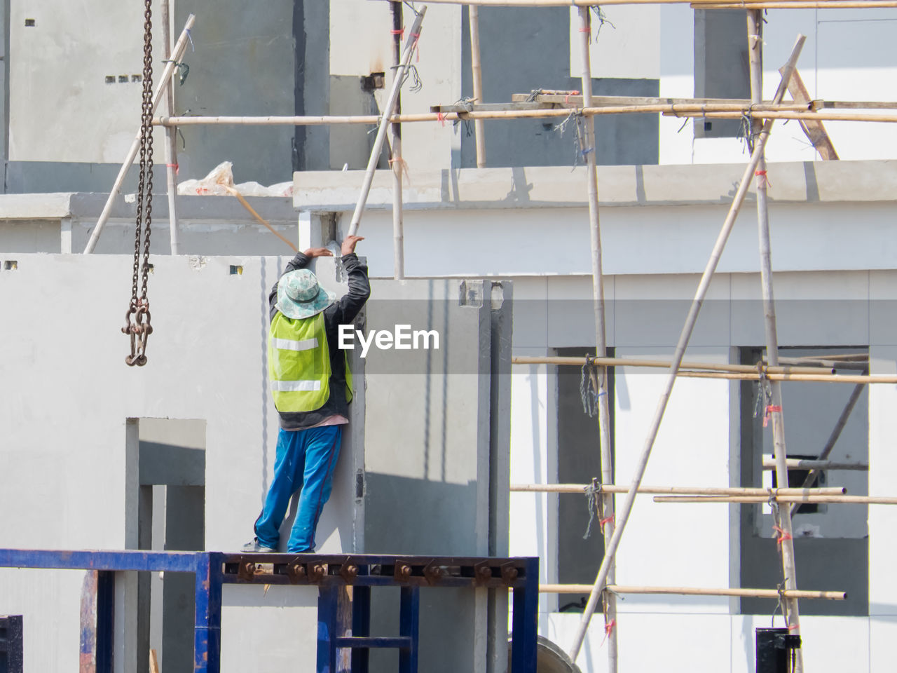 MEN WORKING ON CONSTRUCTION SITE