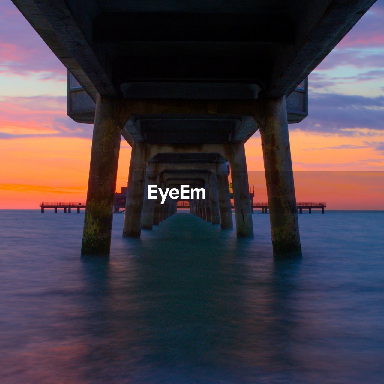 SCENIC VIEW OF PIER OVER SEA AGAINST SKY