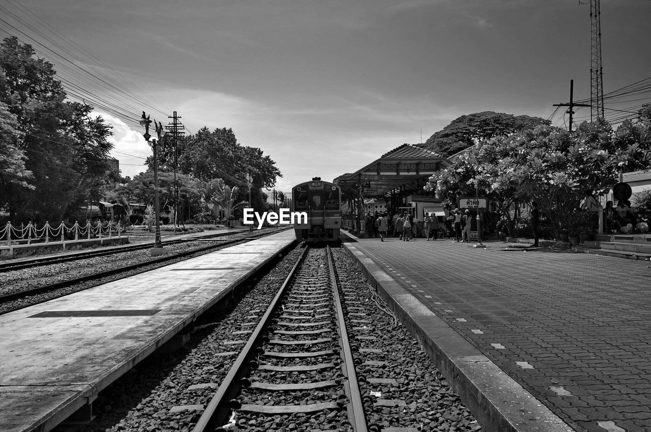 Train at railroad station against sky