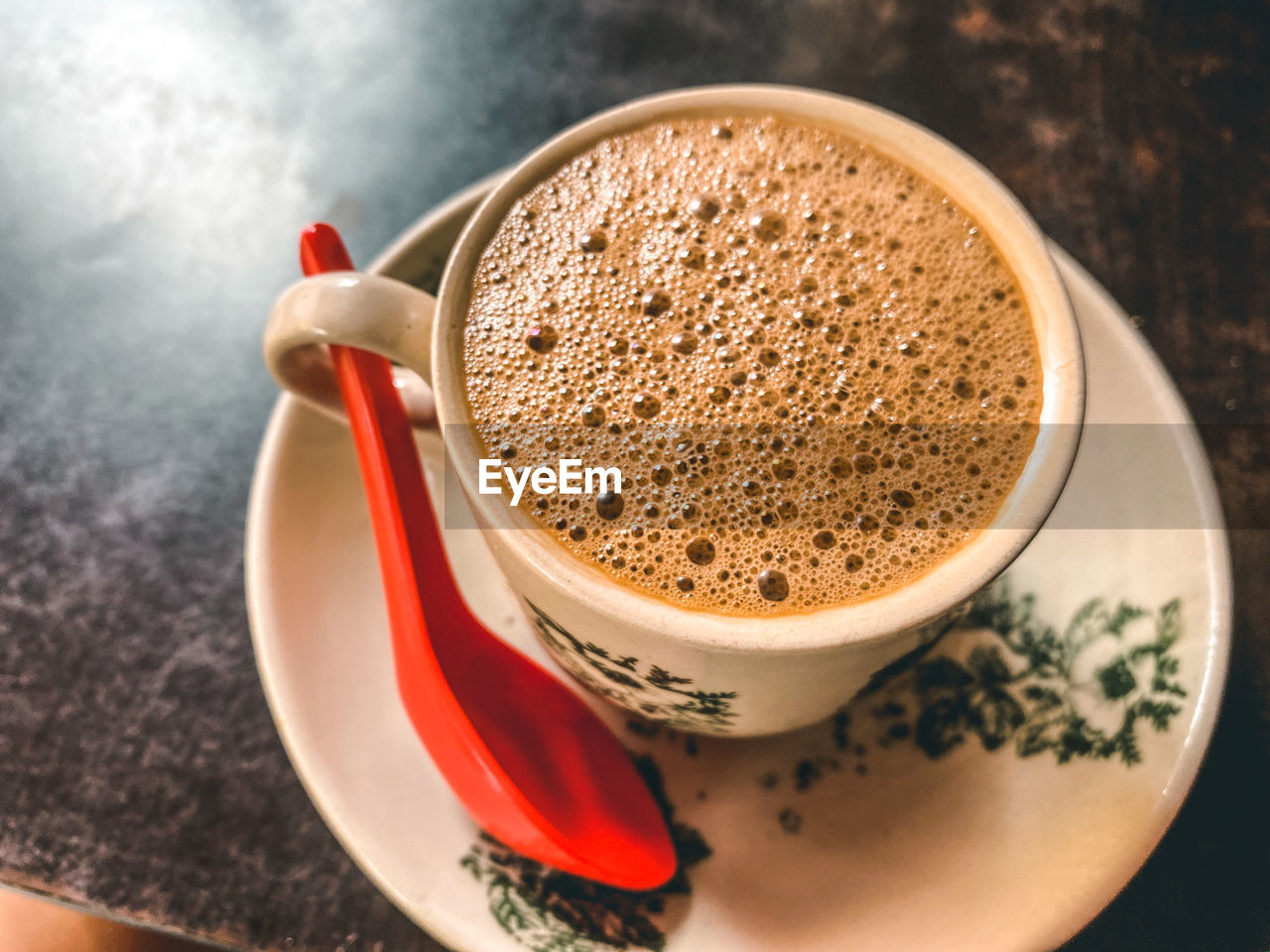 High angle view of coffee cup on table