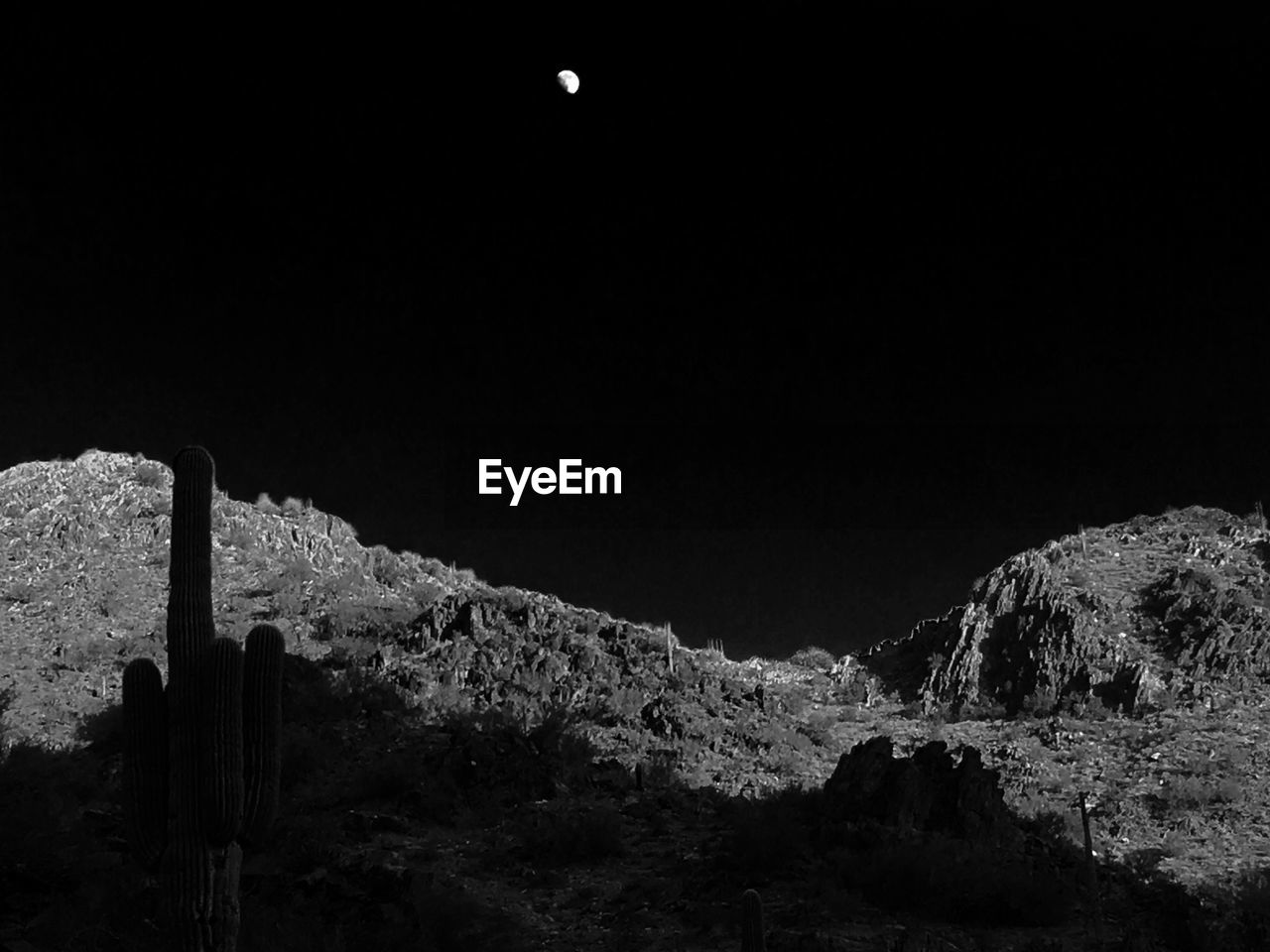 Scenic view of landscape against clear sky at night