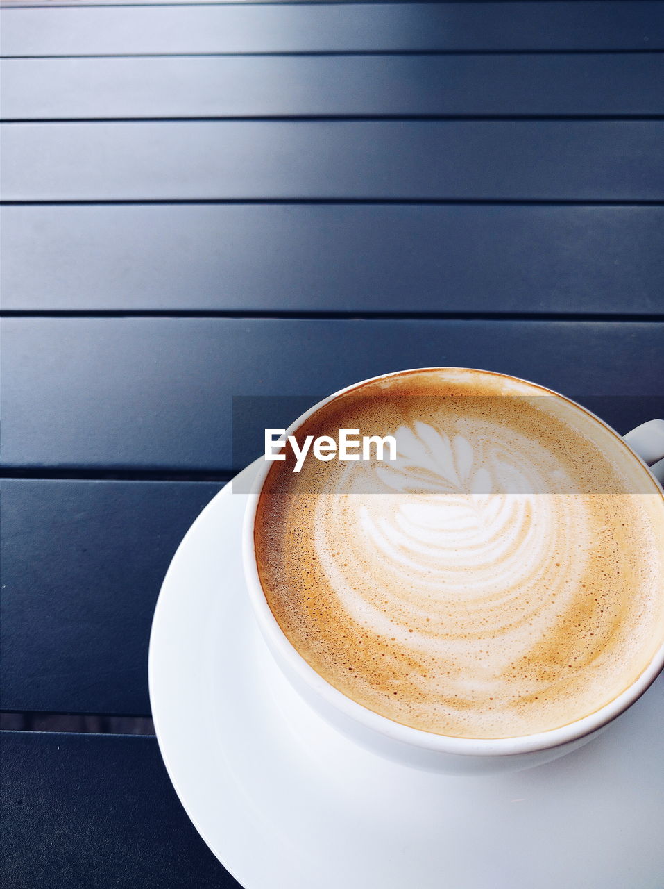 High angle view of coffee cup on table