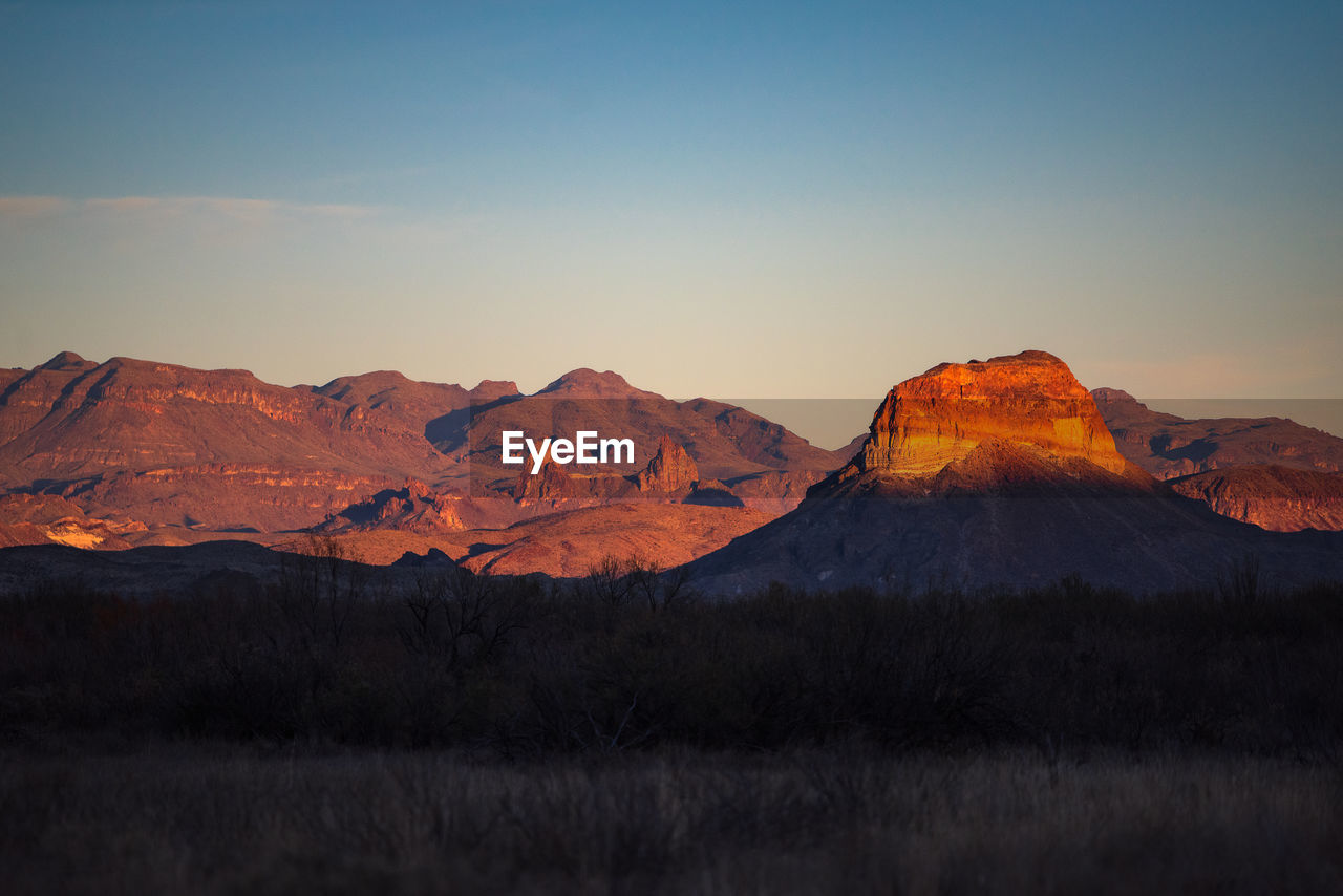 Scenic view of mountains against sky during sunset