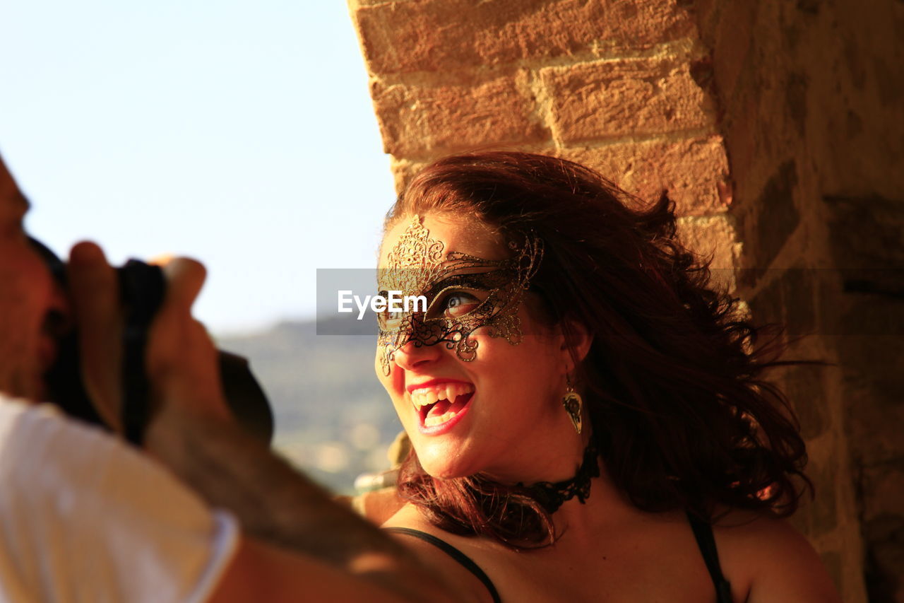 Smiling young woman looking away