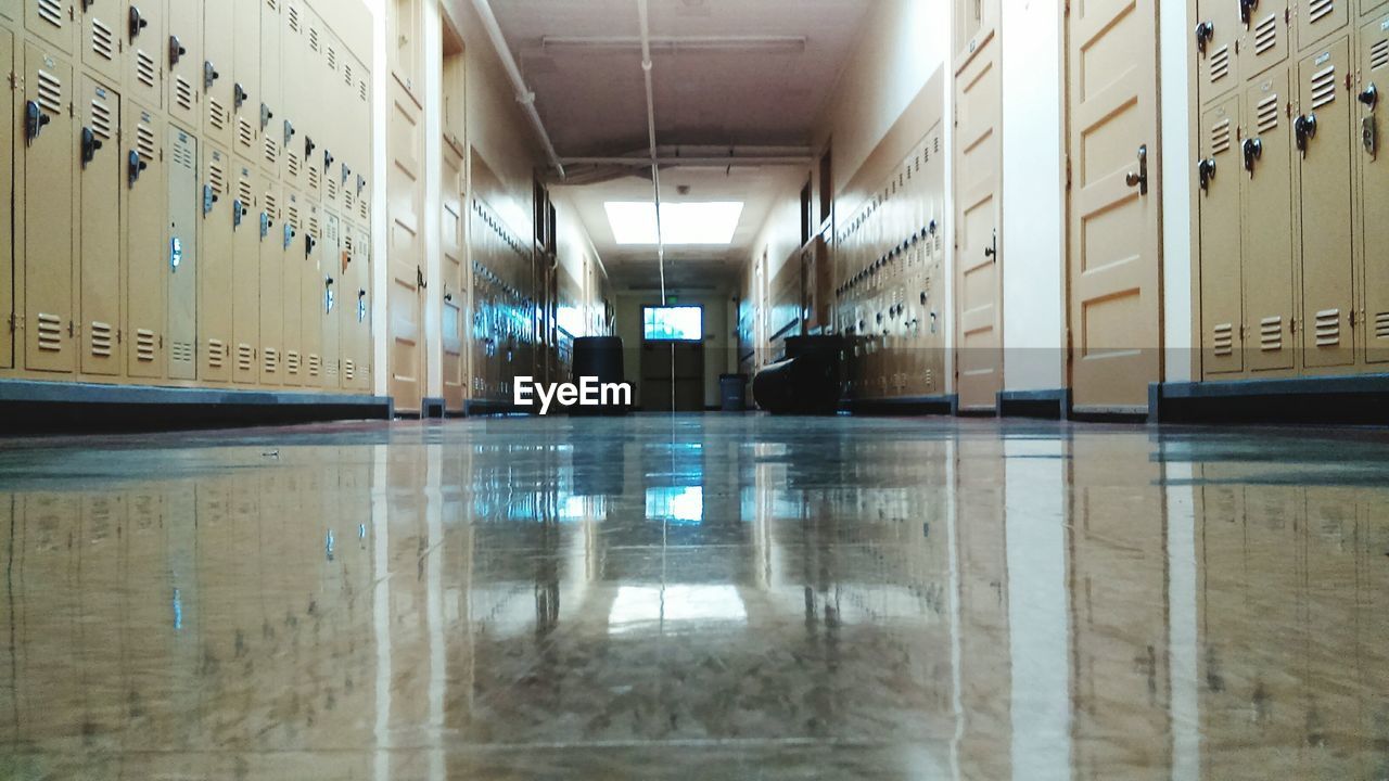 Lockers at empty hallway in school