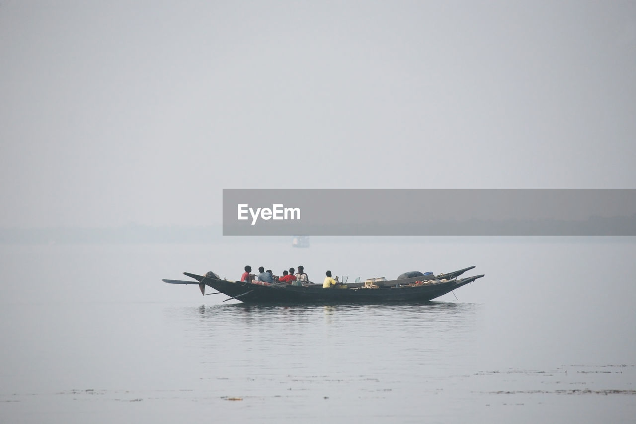 People on boat in sea