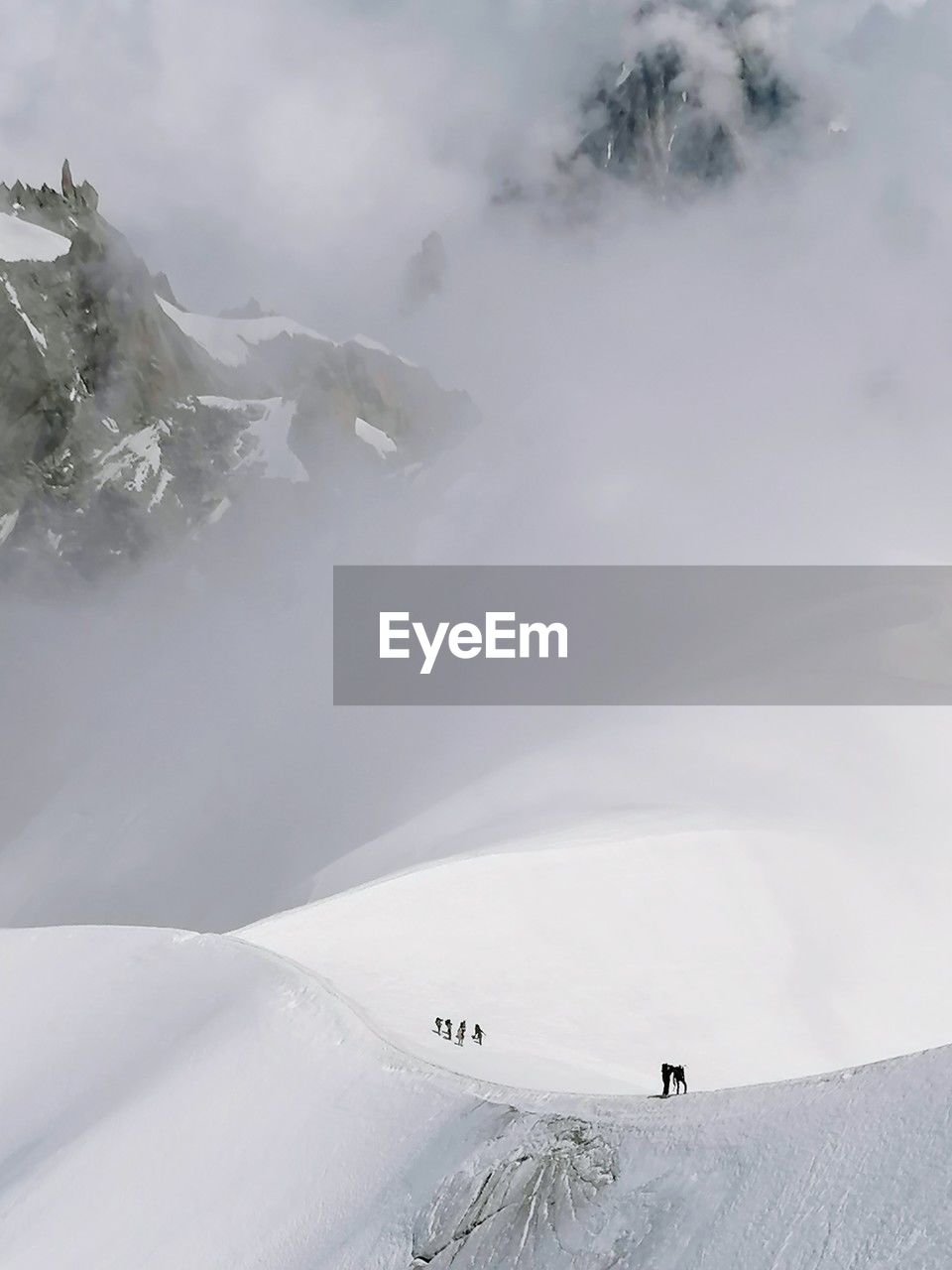 Scenic view of snow covered mountains against sky