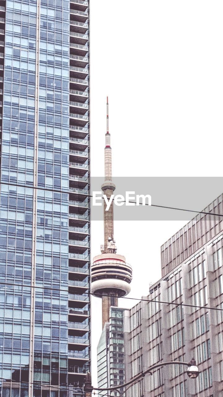 LOW ANGLE VIEW OF MODERN BUILDINGS AGAINST SKY