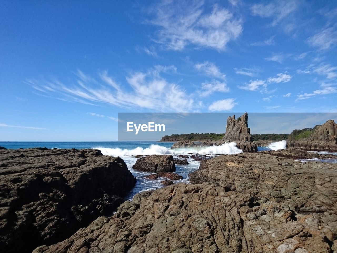 Scenic view of sea against cloudy sky