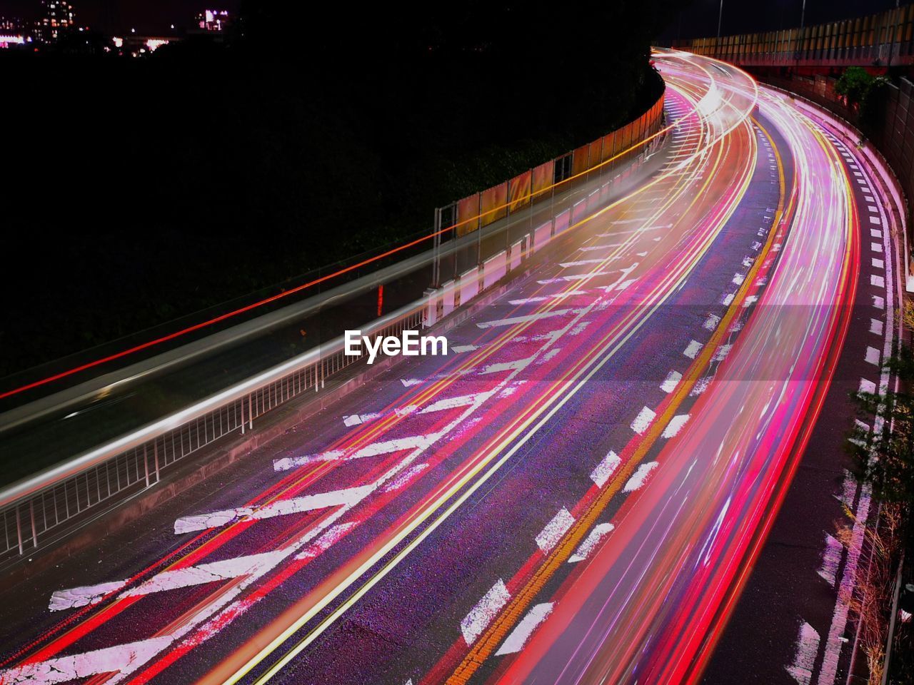 High angle view of light trails on road at night