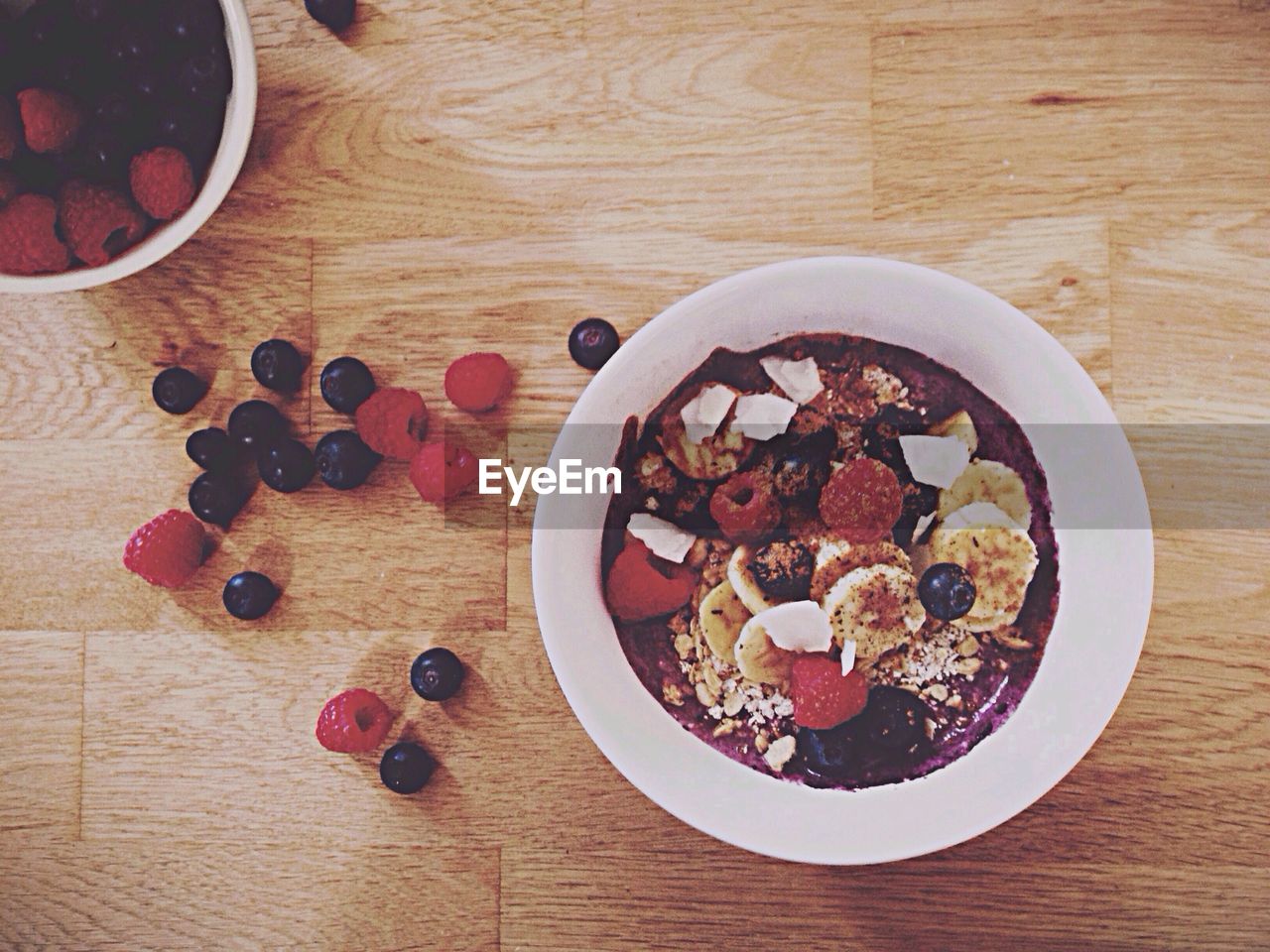 High angle view of muesli and fruits in bowl on table