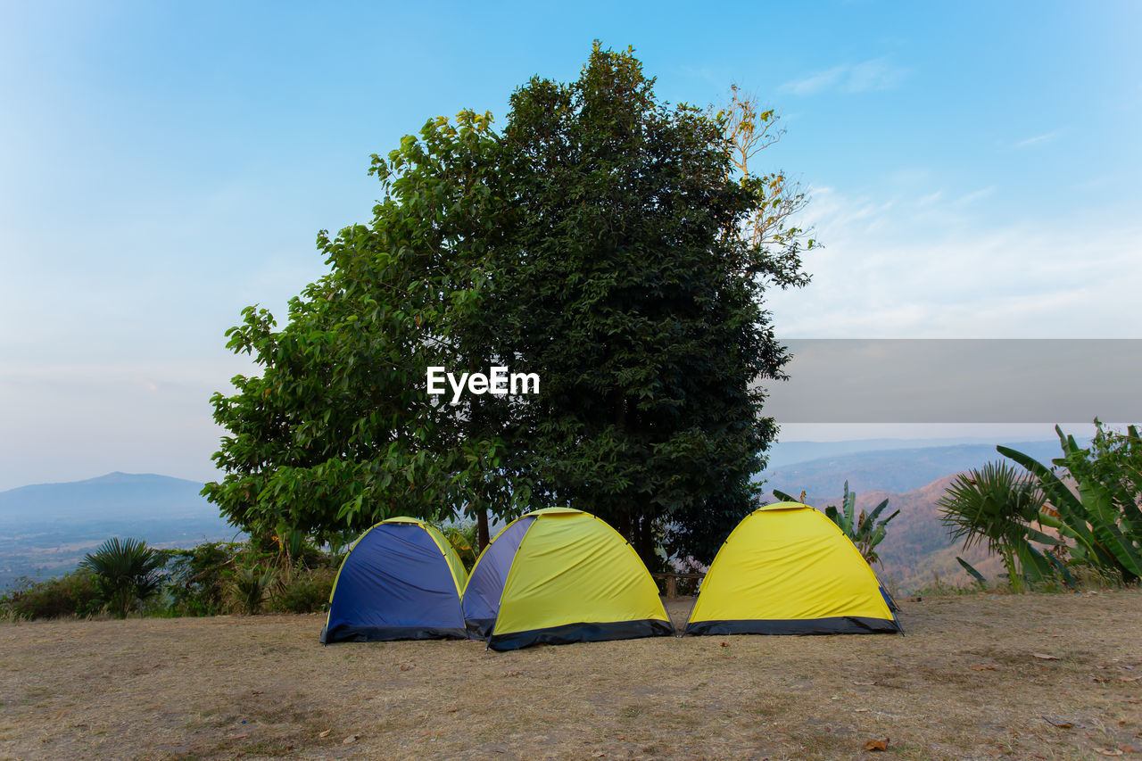 TENT ON BEACH AGAINST SKY